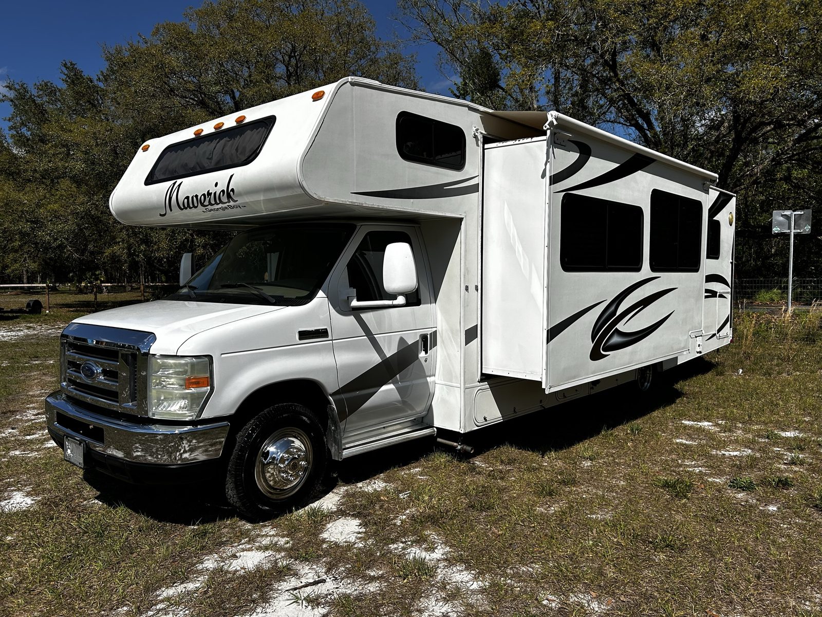 Maverick Class C motorhome in a sunny grassy lot