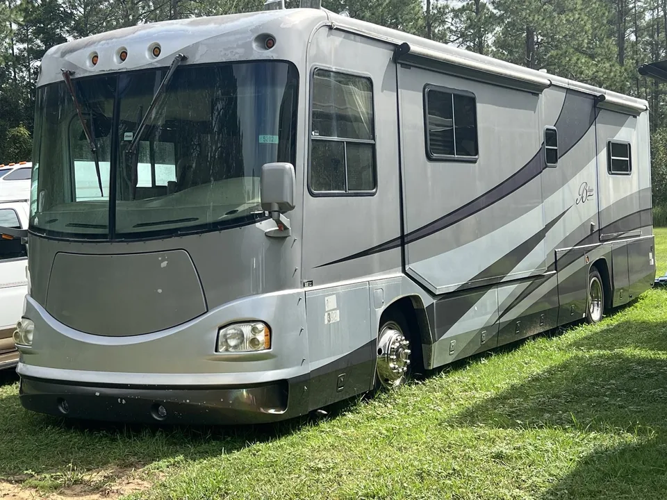 Beaver Class A diesel motorhome purchased for cash on a grassy roadside lot